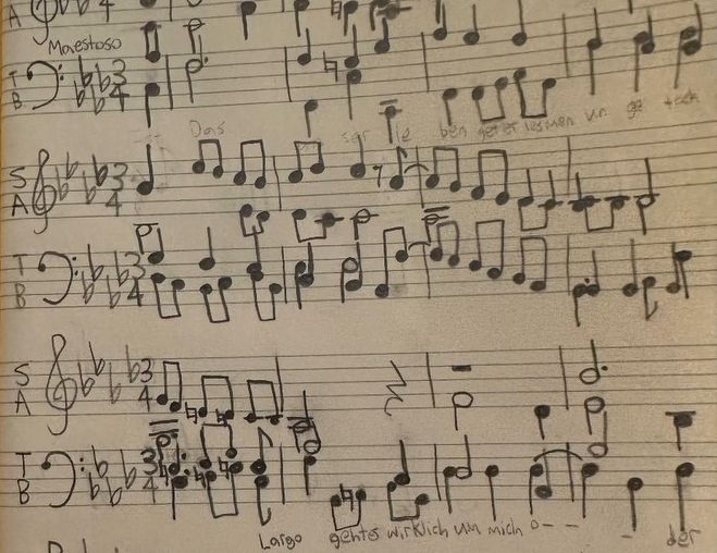 Musical notes handwritten on a page.