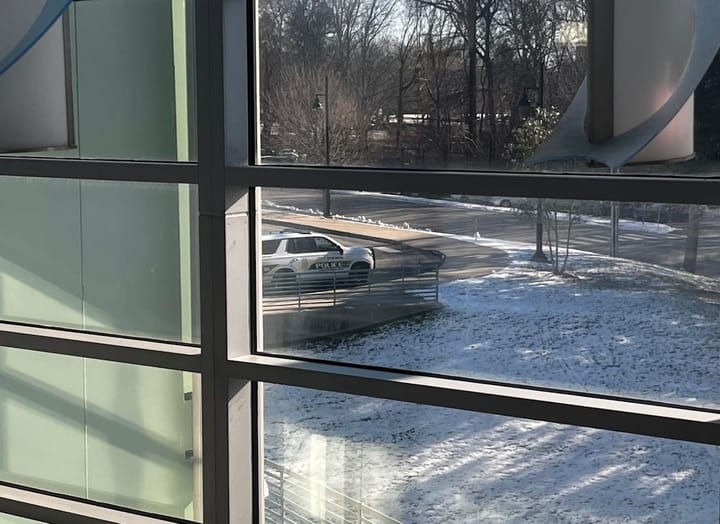 A police car sits parked outside the window of MSMHS.